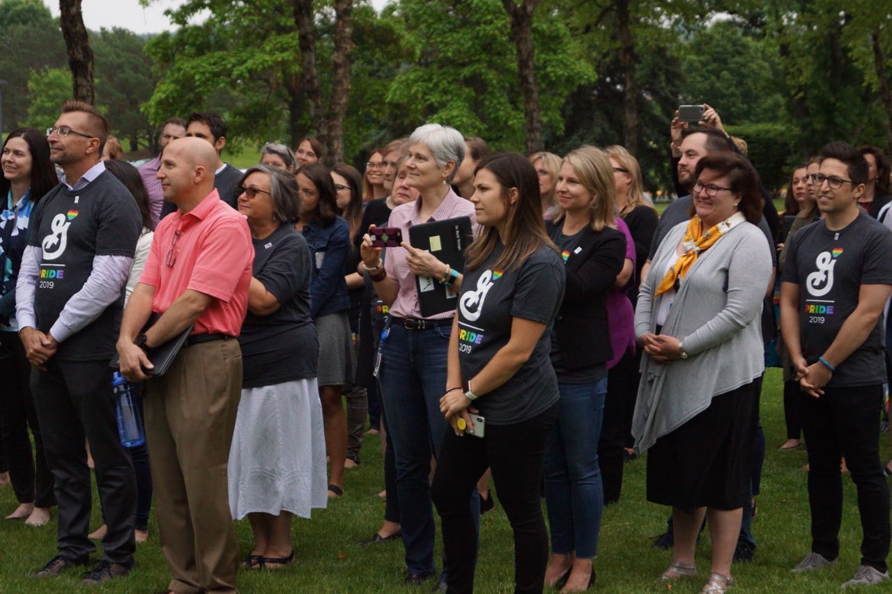 General Mills employees watching Pride Flag being raised