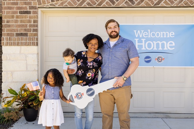 Military family in front of Pillsbury transitional home