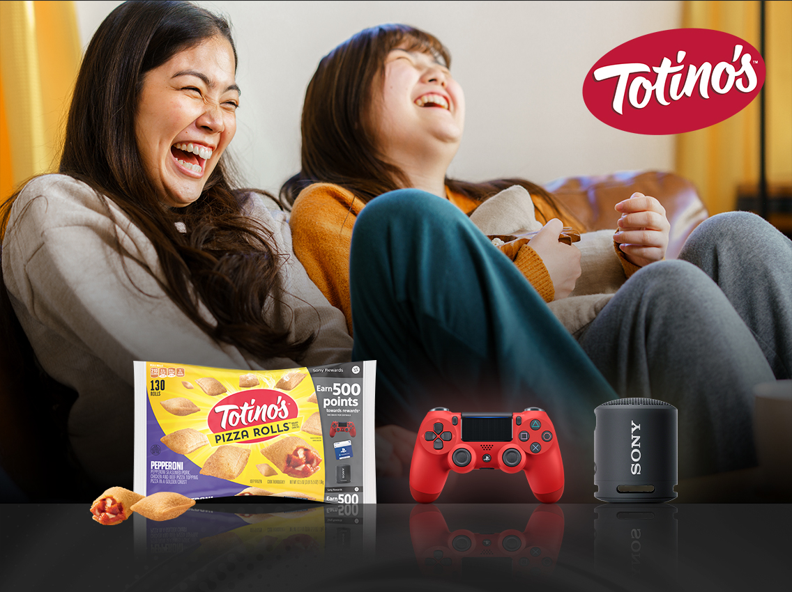 Two girls playing video games with Totino's pizza rolls