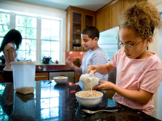 Kids eating breakfast at the table